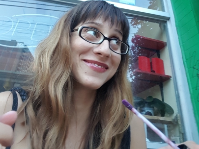 i sneak pics of mar applying lip gloss on queen west